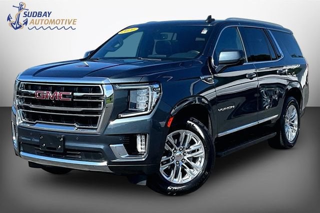 2021 GMC Yukon SLT in Dark Sky Metallic — front three-quarter view