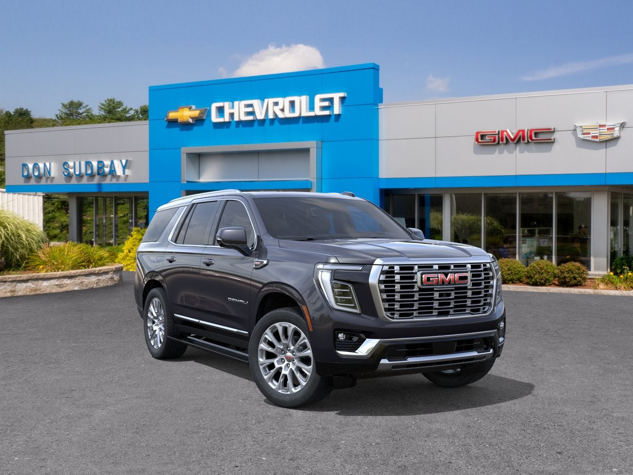2026 GMC Yukon Denali in Titanium Rush Metallic — front three-quarter view
