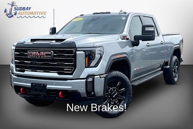 2024 GMC Sierra 2500 HD AT4 in Sterling Metallic — front three-quarter view