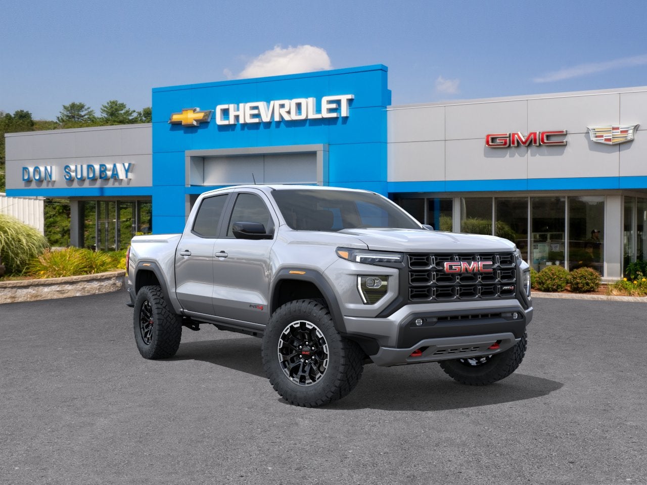 2026 GMC Canyon AT4 in Sterling Metallic — front three-quarter view