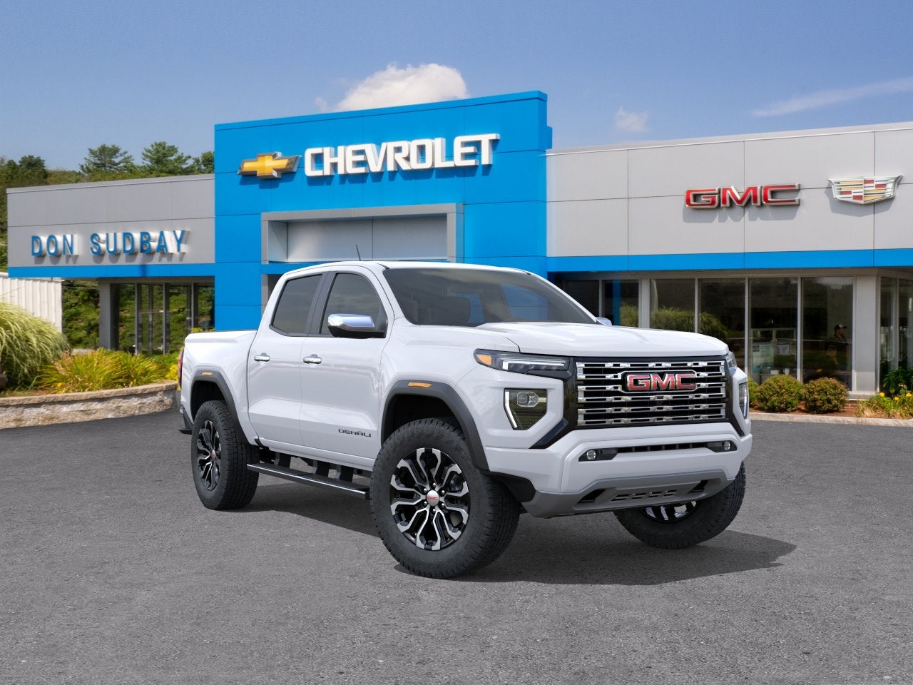 2026 GMC Canyon Denali in Summit White — front three-quarter view