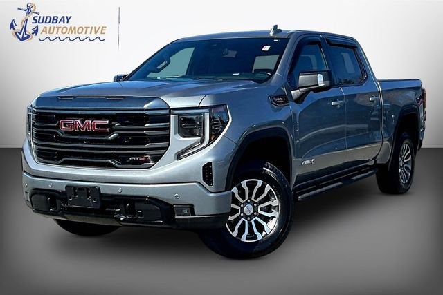 2023 GMC Sierra 1500 AT4 in Sterling Metallic — front three-quarter view